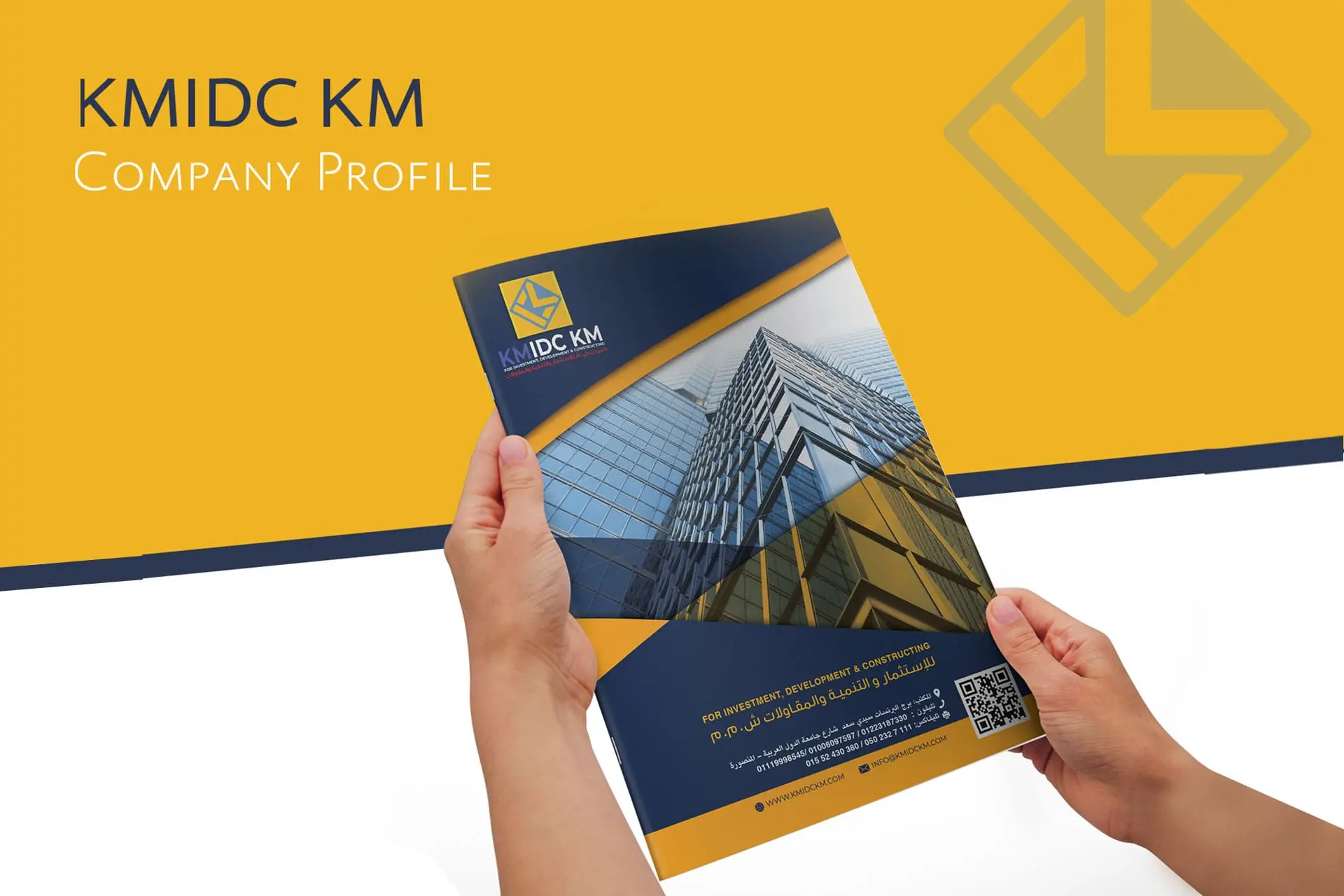 KMIDC KM Company Profile Brochure Cover: A professional corporate document cover for an investment, development, and construction firm. The visual features a modern glass skyscraper with geometric design elements in blue and orange, representing real estate development, contracting, and B2B investment services.