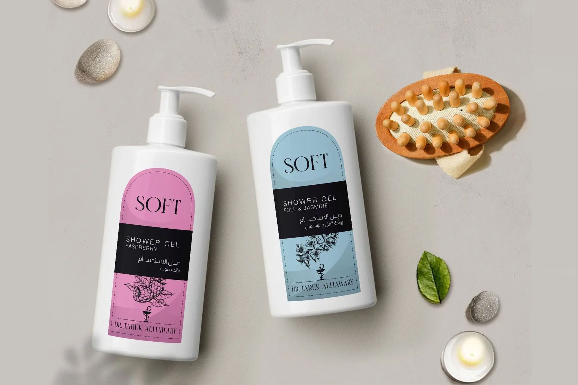 Dr. Tarek Alhawary Soft Shower Gel Product Packaging: Two white pump bottles of shower gel, featuring elegant pink (Raspberry scent) and light blue (Foll & Jasmine scent) labels with botanical illustrations. The product is marketed as a soft, gentle bath and body care item, emphasizing personal hygiene and beauty products.